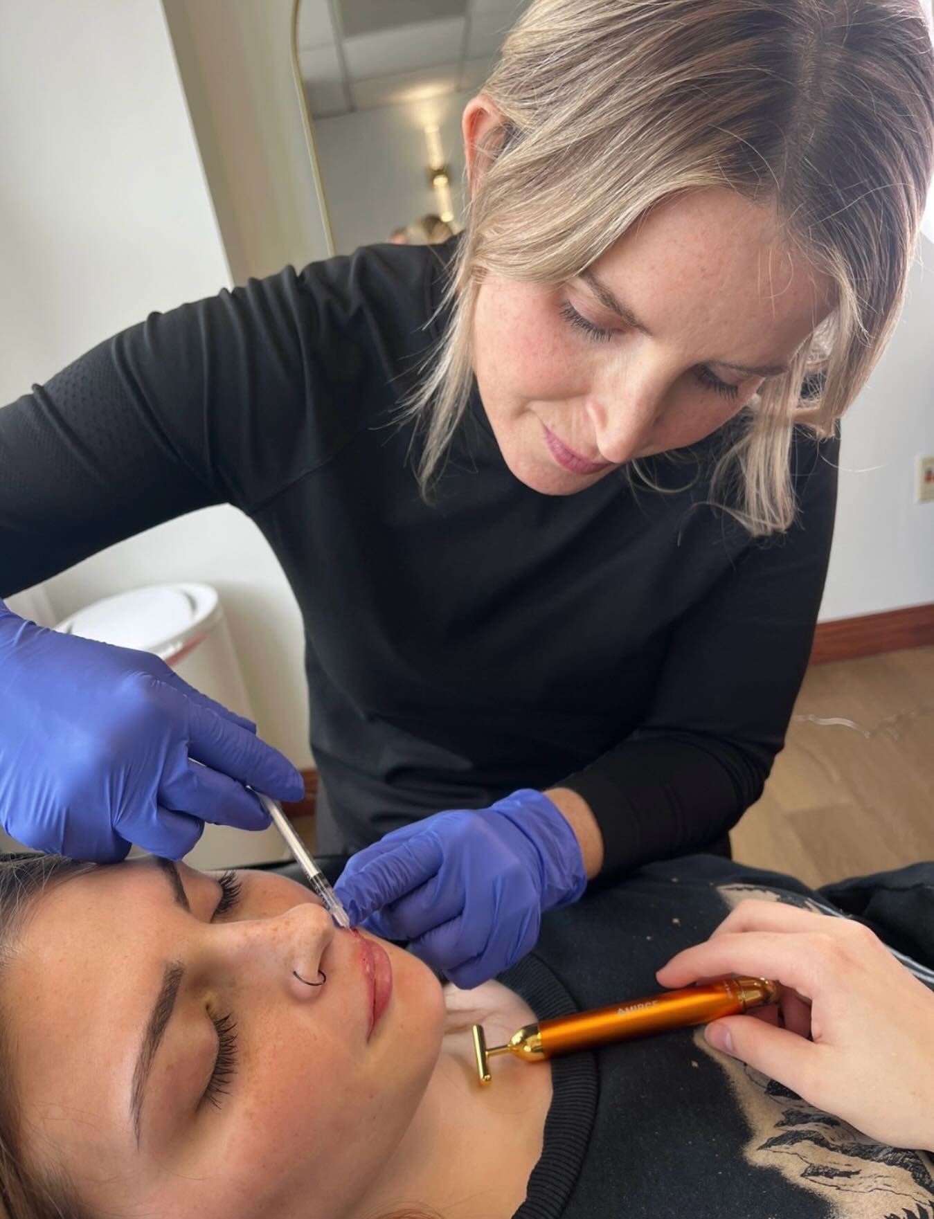 Brandy injects a client's lip